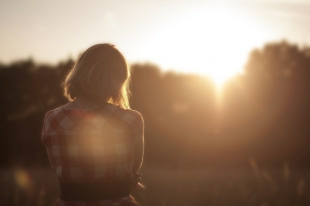 woman-looking-at-forest-at-dawn